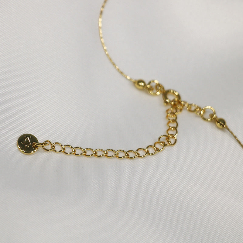 Gilded Copper Necklace with Delicate Pearl Accents