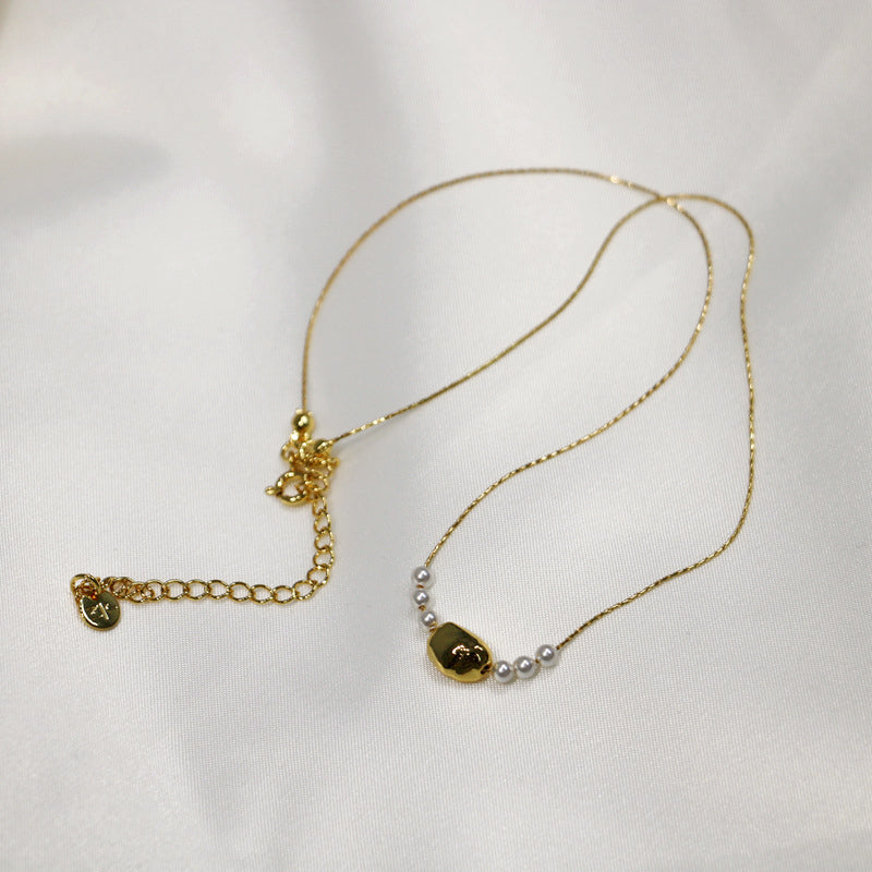 Gilded Copper Necklace with Delicate Pearl Accents