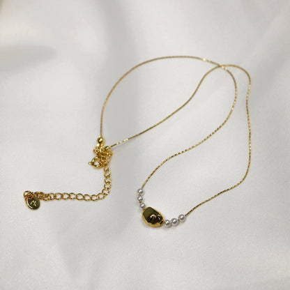 Gilded Copper Necklace with Delicate Pearl Accents